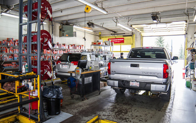 garage area, with two vans parked