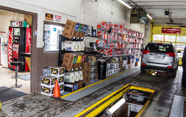 car items on a shelf inside the Minit Lube garage