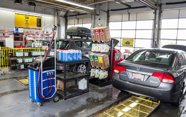 Counters with car oil inside the Minit Lube garage