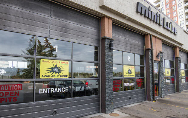 Front door of the company with Minit Lube sign