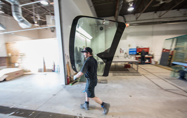employee taking glass to the garage