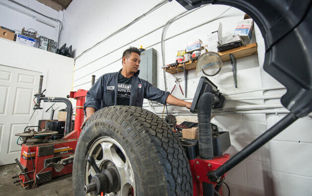 mechanic repairing a tire