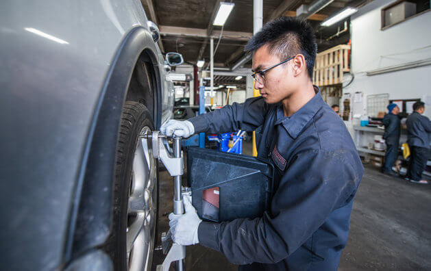 mechanic repairing a tire