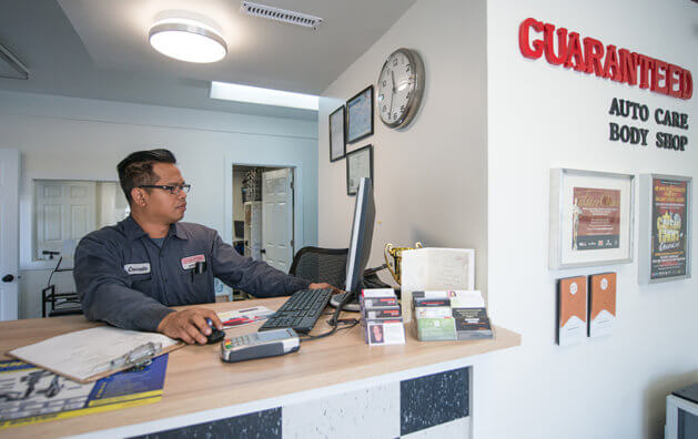 reception attendant behind desk