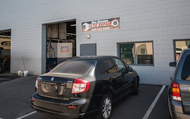 Frontis of the company in which one bay are observed with a black car parked.
