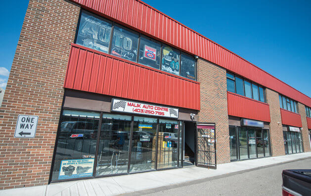 Entrance view of Malik Auto Centre shop.